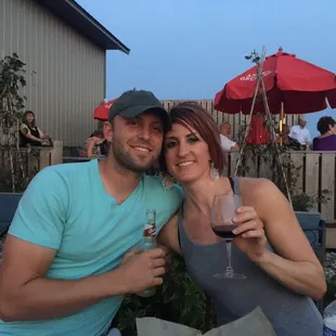 a man and a woman holding wine glasses
