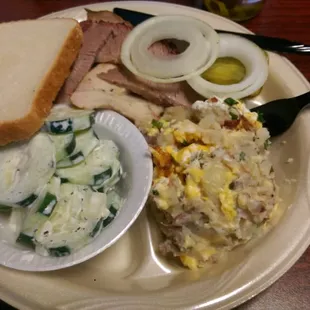 Lunch plate - 2 meats &amp; 2 sides! I got the turkey breast &amp; brisket with tge cucumber salad &amp; potato cassarole (a must try!)