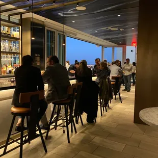 people sitting at the bar