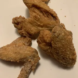 Miniature overcooked wings plus feathers which I took off