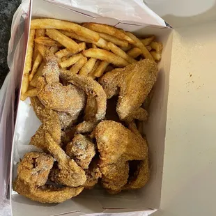 a box of fried fish and fries