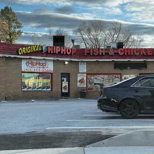 a car parked in front of a restaurant