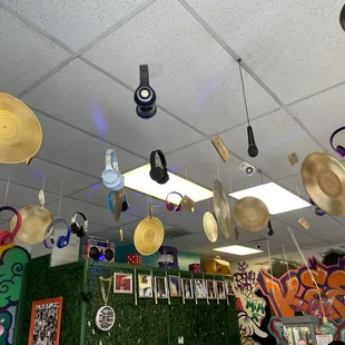 various hats hanging from the ceiling