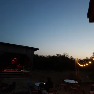 fairy lights and music stage in the backyard hangout with a concessions stand!