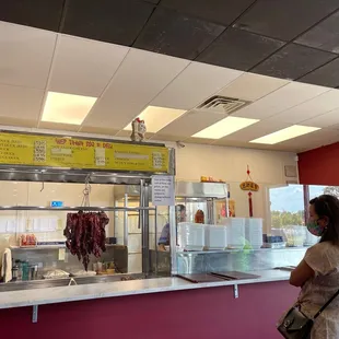 a man and a woman standing in front of the counter