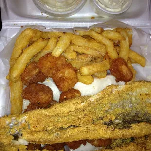 Lake trout, shrimp and fries (close up).