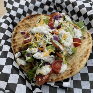 Hippie Gyro
( Pita, Choice of protein, Sauerkraut, Lettuce, Cherry Tomato, Carrot, Purple Cabbage, Cheese &amp; Garlic Cream Sauce.)