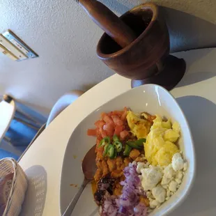 Tasty "foul"  - mashed fava beans with plenty of topping and a flavorful, spicy sauce