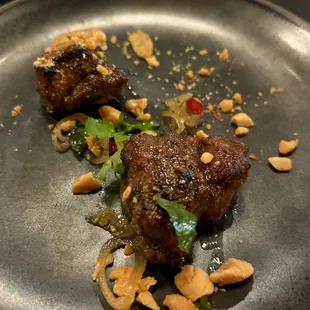 Yakitori lemongrass pork with nuoc Cham, peanuts, and cilantro. Just a hint of heat from the Thai chilies made this a fabulous bite of food.