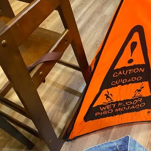 a caution sign on the floor