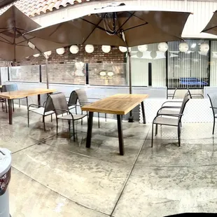 handful of tables outside on the south side of the building