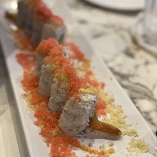 a plate of sushi on a table
