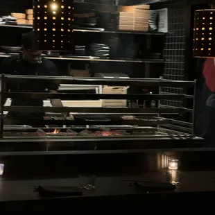 a chef preparing food in a restaurant kitchen