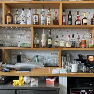 a bar with shelves of liquor