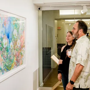 First Friday guests enjoying Jamie Allen's artwork!