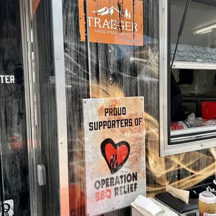 a sign on the side of a food truck