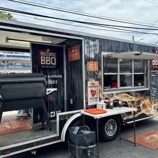 a man standing in front of a food truck