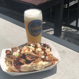 The Bus - custom smoked sausage topped with pork, brisket, and sweet vinegar slaw