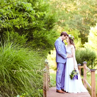 Brides cross over our lush gardens and pond area to get to our beautiful ceremony spot. Photo by April Renee Photography