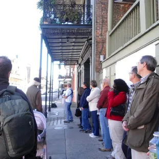 Listening to our tour guide as he told us stories.