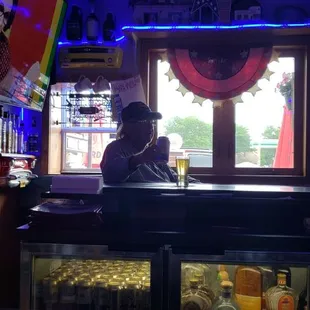 a woman sitting at the bar