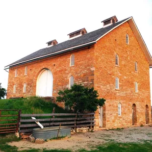 Historic Taylor Barn was built in 1879 from native limestone.  View from the northwest showing the forth floor, open to the west.