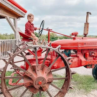 a boy on a tractor