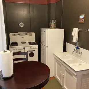 Kitchenette. Not sure if the stove is actually functioning or just for decorative use.