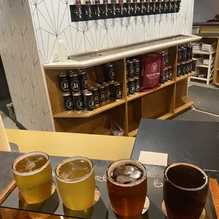 a variety of beers on a tray