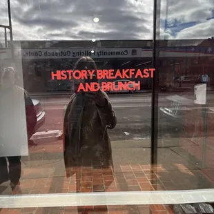 reflection of a person in a window