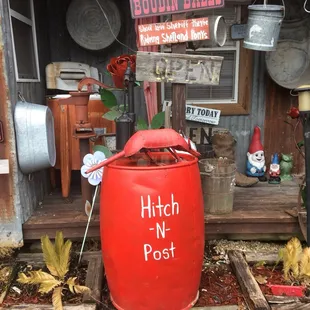 shows a red barrel with the words hitch - n - post on it