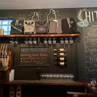 a woman standing in front of a chalkboard