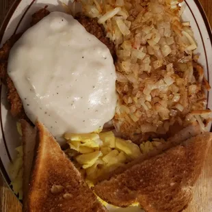 chicken fried steak, hashbrowns with onions.