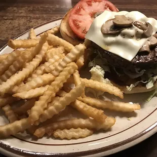 Swiss mushroom burger with fries.