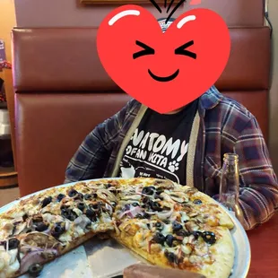 a pizza with a heart on it