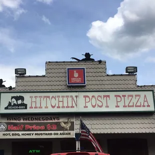a red truck parked in front of a restaurant
