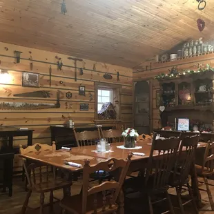 Interior, lots of wood, photos, tools and taxidermy. It fits