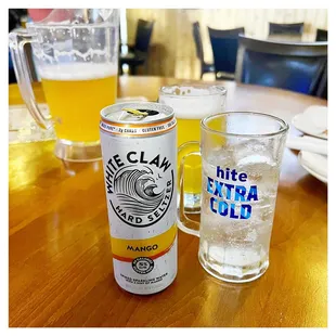 a can of beer and a glass of water
