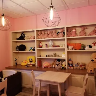 Seating area with lots of stuffed animals lol
