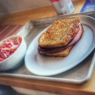 cole slaw and ham and cheese sandwich