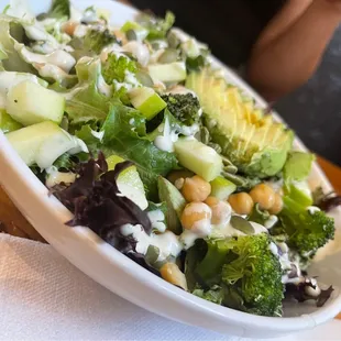 a bowl of broccoli and chick salad