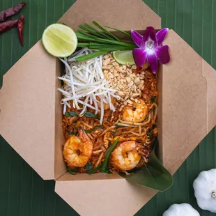 a box of noodles and shrimp