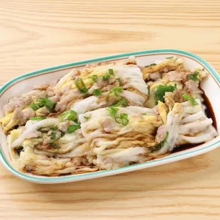 a plate of food on a wooden table