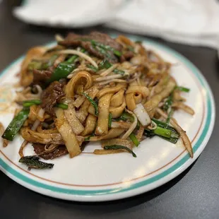 a plate of stir fried noodles