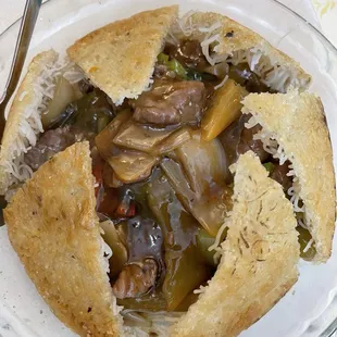 Pan fried rice noodles with pickled mustard greens and beef