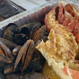 Muscles and lobster . The crawfish were big and juicy tooo !