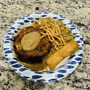 Egg foo young, gravy, crunchy egg roll, fried rice and topped with crispy noodles. Delish!!!