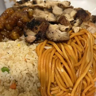 a plate of noodles and meat