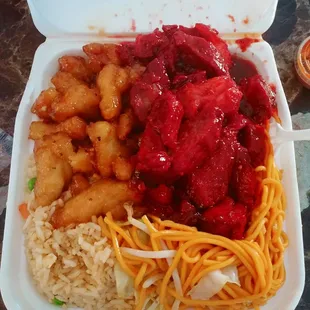 Orange chicken, bbq pork, fried rice, and chow mein. Big portions! Very savory.