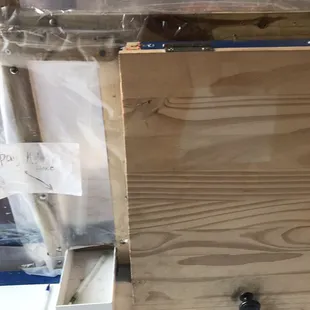 Put your payment in the small open box, take your food from the wooden box.